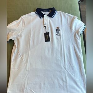 Polo by Ralph Lauren. Polo bear on the side.